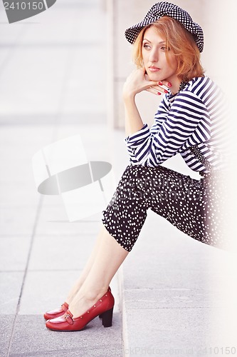 Image of Beautiful girl in the striped vest