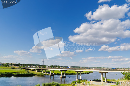 Image of bridge over river and blue sky