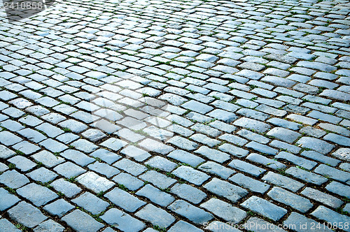 Image of cobbled road as background