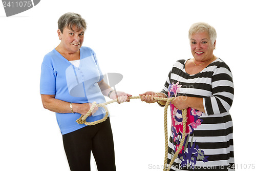 Image of Two female seniors pulling on a rope