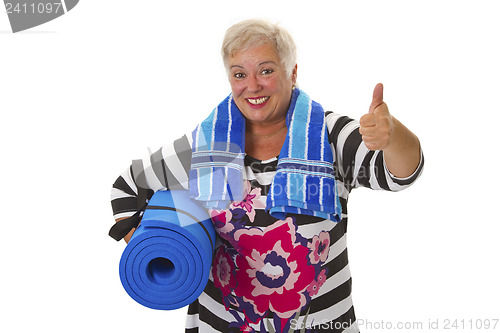 Image of Female senior with blue gym mat 