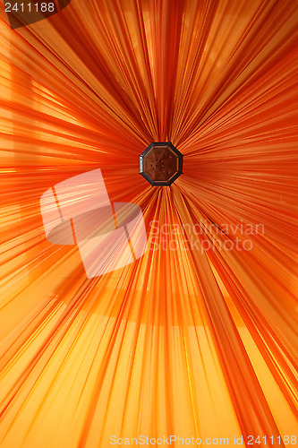 Image of Abstract orange lines and black hole