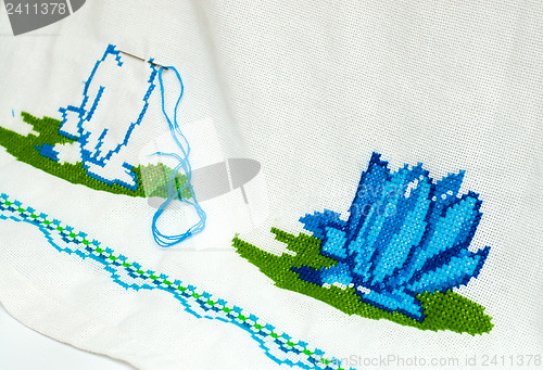 Image of unfinished embroidered serviette by cross-stitch pattern