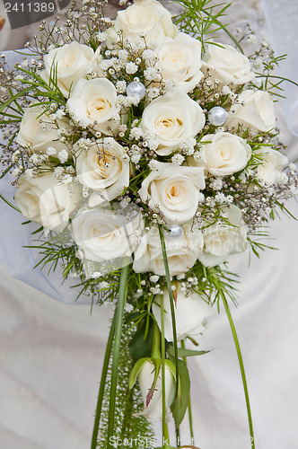Image of white fine rose in wedding bouquet