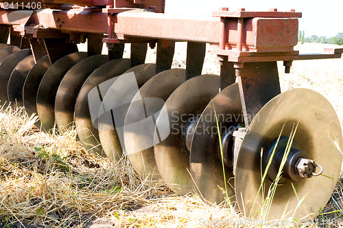 Image of closeup agricultural machine on the field