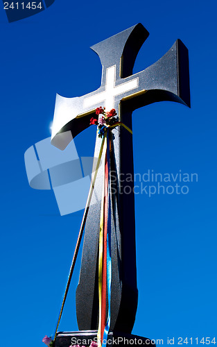 Image of Christianity cross on blue sky background