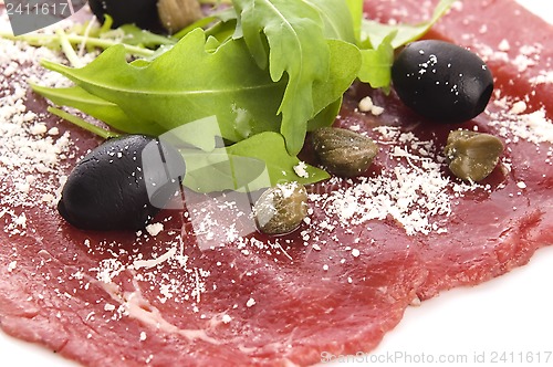 Image of Beef carpaccio with rucola and parmesan 