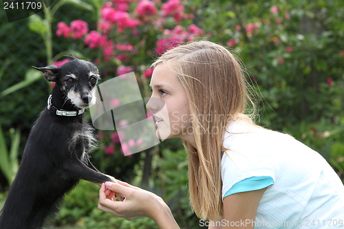 Image of Young girl with her little dog