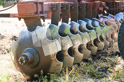 Image of closeup agricultural machine on the field