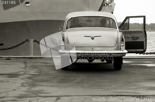 Image of in rainy day car,ship near mooring line