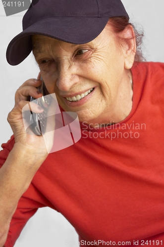 Image of active grandmama speaking on the mobile phone