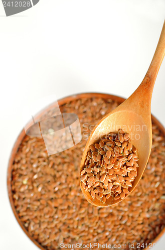 Image of close up of flax seeds and wooden spoon