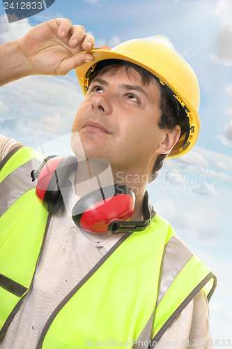 Image of Engineer or builder looking up at progress