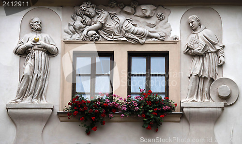 Image of Saints on facade, House of the Golden Well, Prague,