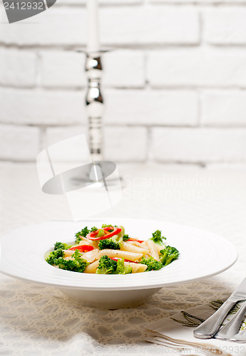 Image of Italian penne pasta with broccoli and chili pepper