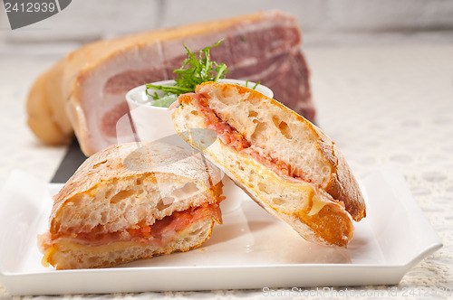 Image of ciabatta panini sandwich with parma ham and tomato