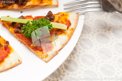 Image of Turkish beef pizza with cucumber on top