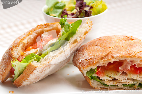 Image of ciabatta panini sandwich with chicken and tomato