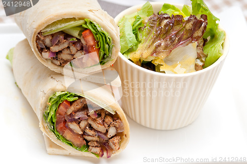 Image of kafta shawarma chicken pita wrap roll sandwich