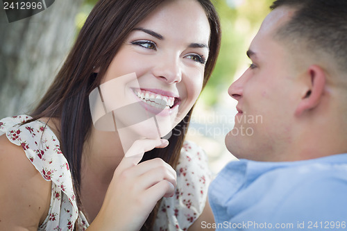 Image of Mixed Race Romantic Couple Portrait in the Park
