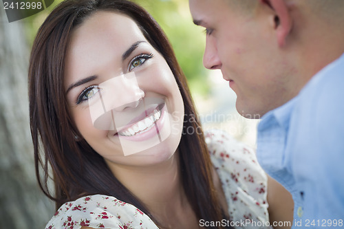 Image of Mixed Race Romantic Couple Portrait in the Park