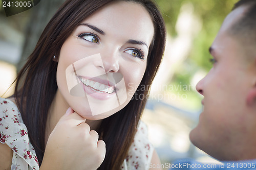 Image of Mixed Race Romantic Couple Portrait in the Park