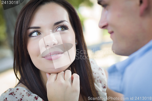 Image of Mixed Race Romantic Couple Portrait in the Park