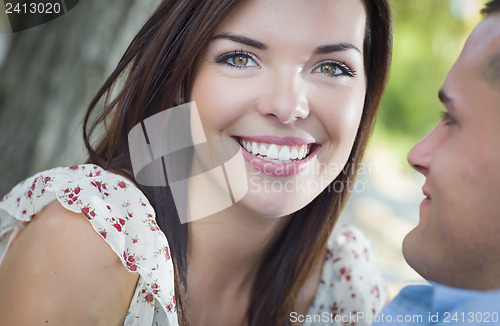 Image of Mixed Race Romantic Couple Portrait in the Park