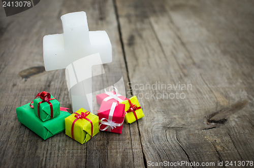 Image of Religious cross with presents