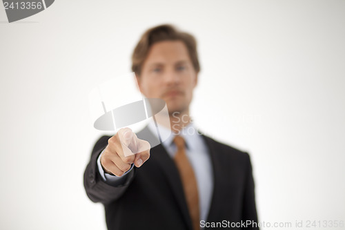 Image of Smiling Young Businessman Pointing at the Camera