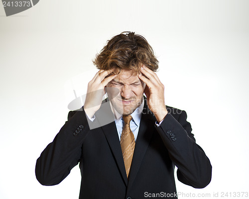 Image of Suffering businessman with migraine