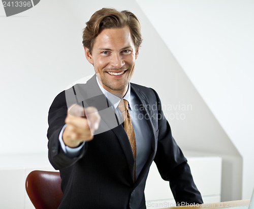 Image of Young Businessman Pointing at the Camera