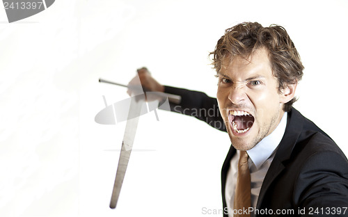 Image of Crazy businessman attacking with sword