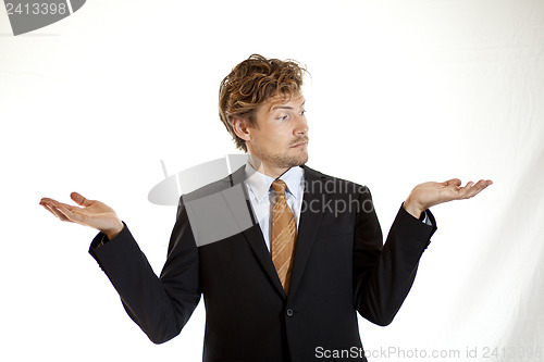 Image of Businessman showing off two ideas