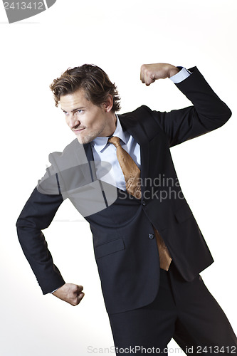 Image of Strong businessman showing off