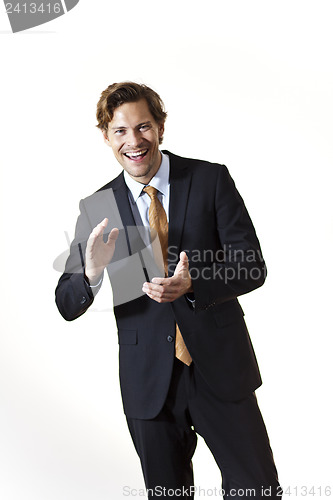 Image of Laughing businessman clapping his hands