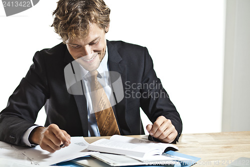 Image of Businessman reading something funny