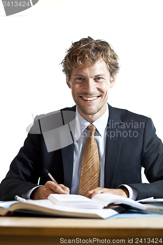 Image of Smiling businessman at work