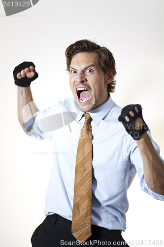 Image of Brutish businessman ready to punch