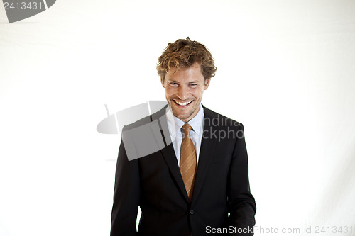 Image of Relaxed businessman lauighing