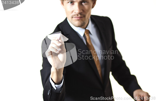 Image of Businessman getting ready to throw paper airplane