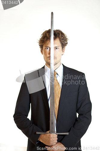 Image of Silent businessman holding sword