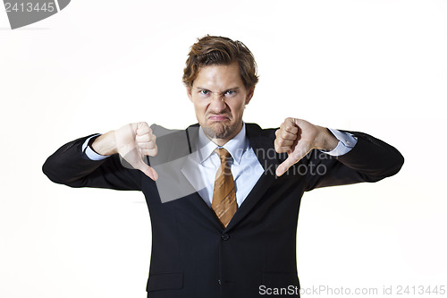 Image of Unhappy businessman giving thumbs down