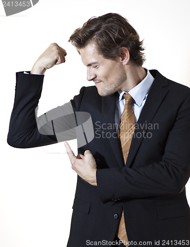 Image of Businessman showing off mucsles