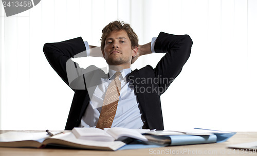 Image of Businessman realaxing in his chair