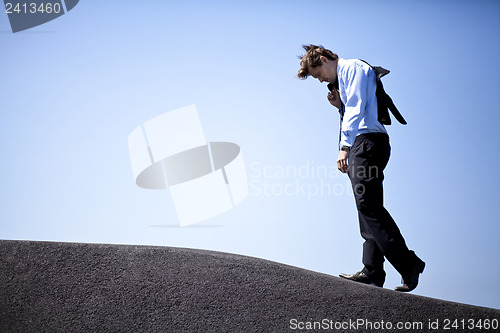 Image of Businessman climbing a hill