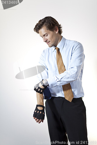 Image of Brute businessman pulling up sleeves