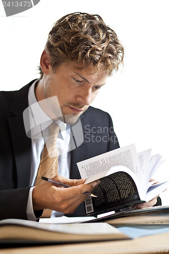 Image of Businessman looking at papers