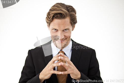 Image of  Contemplating Businessman holding fingers together in front