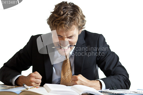 Image of Angry businessman at desk